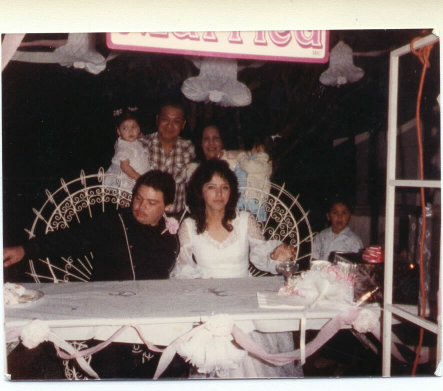 Here is a picture of me (when I was little), my grandpa, my grandma, and my cousins at a wedding. (Start in back row left to right)